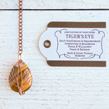 Handmade rose gold copper color tea ball infuser for loose leaf tea with teardrop shaped tiger's eye gemstone crystal wire wrapped with copper wire into tree of life design - includes tag with associations and properties of the stone