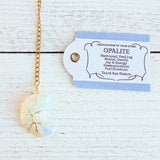 Gold color tea ball infuser for loose leaf tea with moon shaped opalite gemstone crystal wire wrapped with gold wire into tree of life design - includes tag with association and properties of the stone