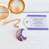 Gold color tea ball infuser for loose leaf tea with moon shaped lapis lazuli gemstone crystal wire wrapped with gold wire into tree of life design - includes tag with association and properties of the stone