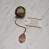Gold Wire-Wrapped Teardrop Gemstone Tea Ball Infuser - Golden colored tea ball with gold wire wrapped tree on crystal stone tear pendant