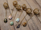Gold Wire-Wrapped Teardrop Gemstone Tea Ball Infuser - Golden colored tea ball with gold wire wrapped tree on crystal stone tear pendant
