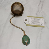Gold Wire-Wrapped Teardrop Gemstone Tea Ball Infuser - Golden colored tea ball with gold wire wrapped tree on crystal stone tear pendant