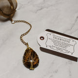 Gold Wire-Wrapped Teardrop Gemstone Tea Ball Infuser - Golden colored tea ball with gold wire wrapped tree on crystal stone tear pendant