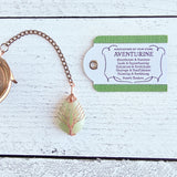 Handmade rose gold copper color tea ball infuser for loose leaf tea with teardrop shaped green aventurine gemstone crystal wire wrapped with copper wire into tree of life design - includes tag with associations and properties of the stone