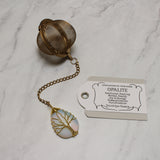 Gold Wire-Wrapped Teardrop Gemstone Tea Ball Infuser - Golden colored tea ball with gold wire wrapped tree on crystal stone tear pendant